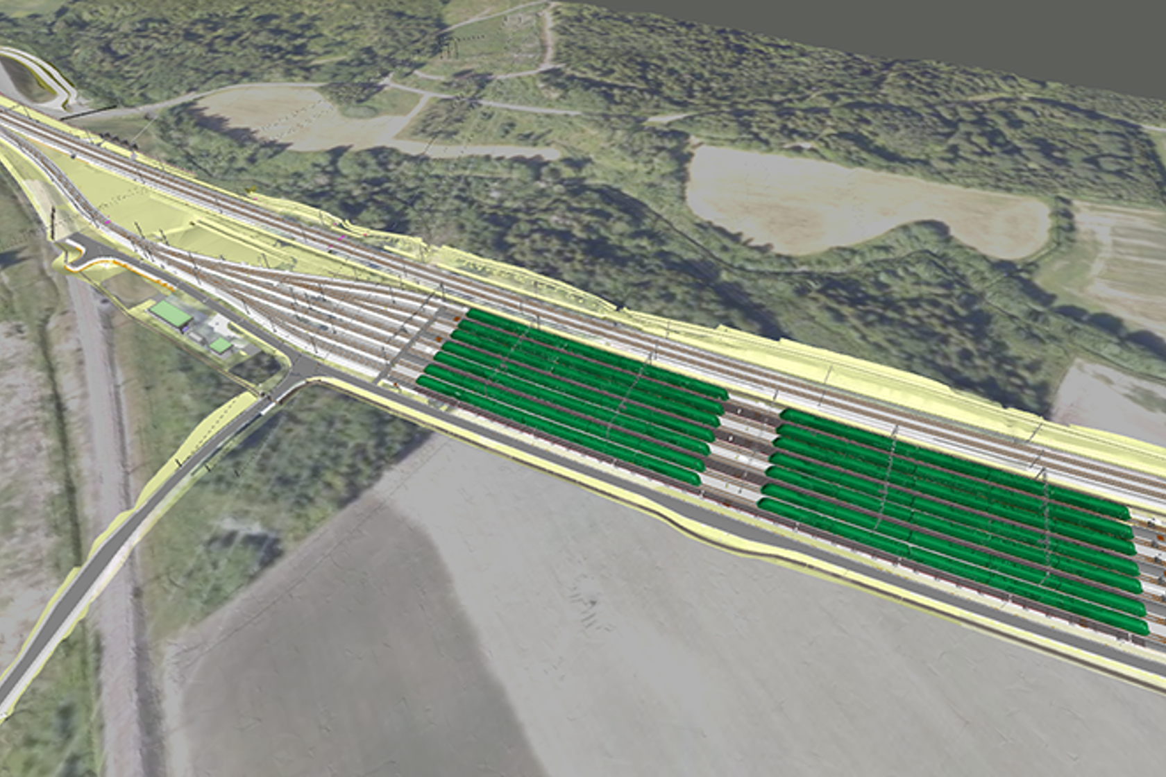 Modellbilde av togparkeringsannlegg, skog og landbruk